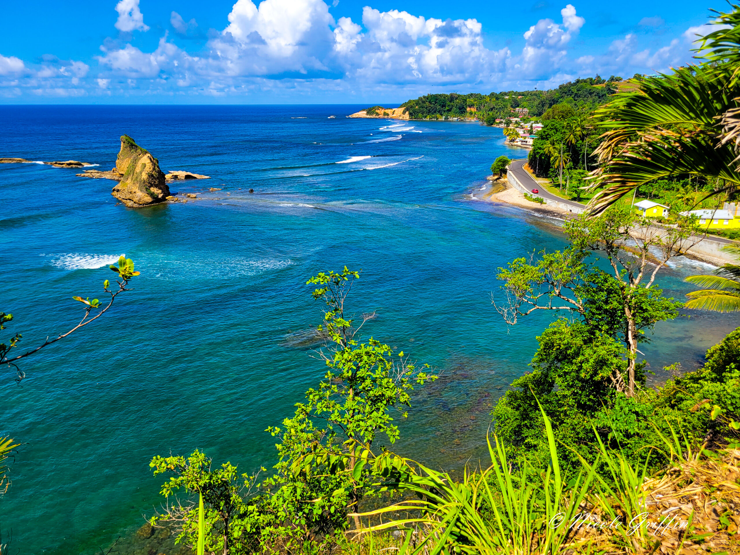 blue waters seen from a cliff above the sea